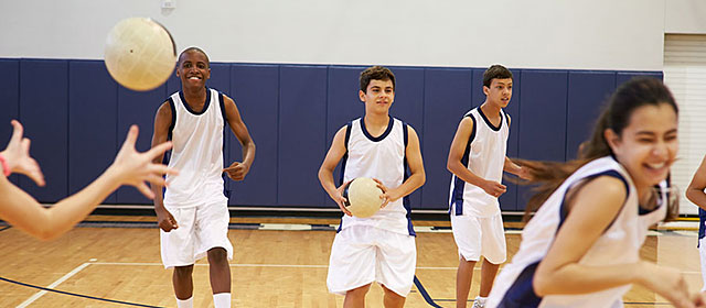 High school students playing dodge ball