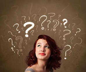 brunette female looking up at question marks surrounding head