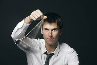 male hypnotist with swinging clock