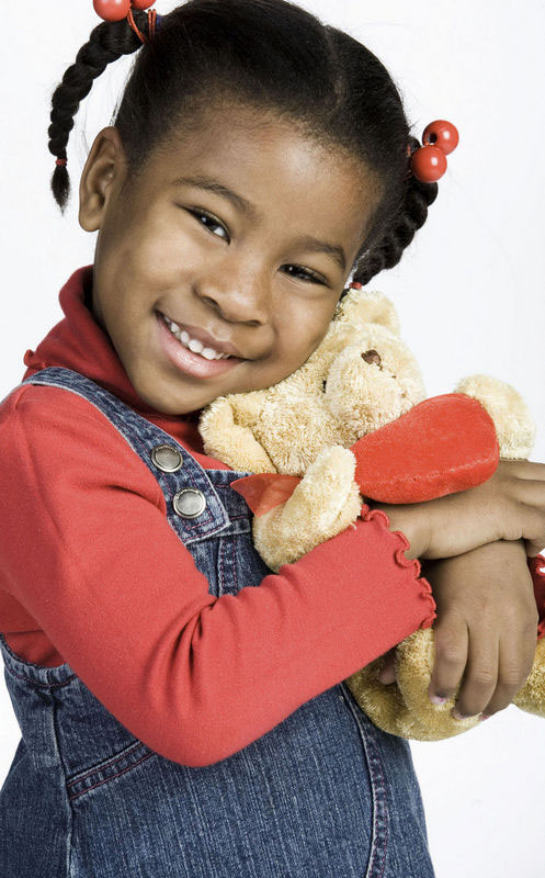 Young child holding a stuffed animal