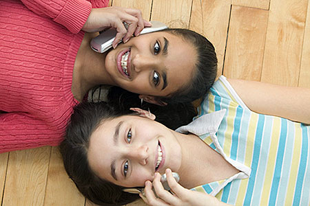 Teenagers talking on the phone