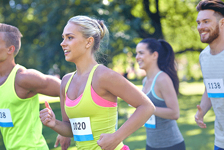 four marathon runners outside