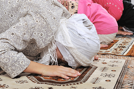 Muslim girls praying