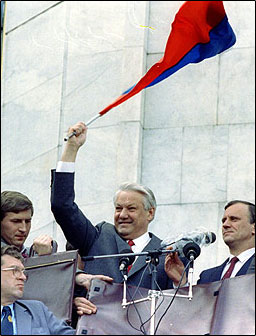 Image of Boris Yeltisin holding flag of Russia.