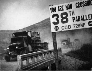 Image of military trucks approaching 38th parallel in Korea.